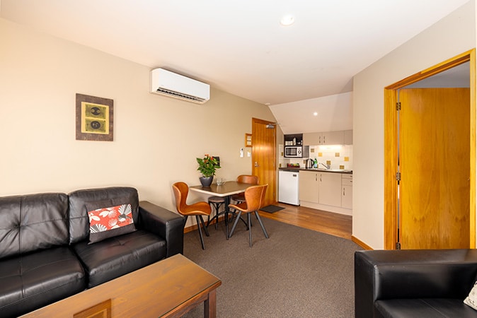 Living and bedroom area of triple bedroom room at Settlers Boutique Motel - Hanmer Springs accommodation