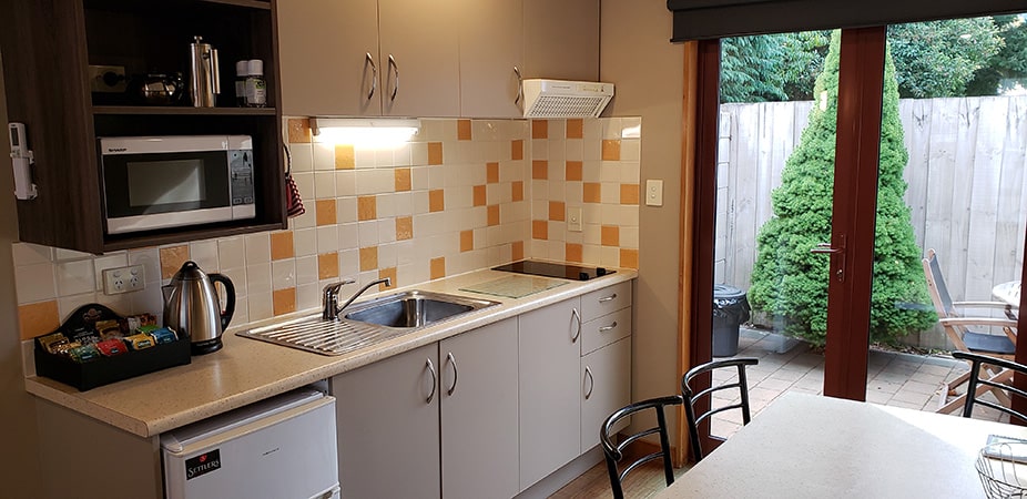 Kitchen area of two bedroom - ground floor room at Settlers Boutique Motel - places to stay in Hanmer Springs